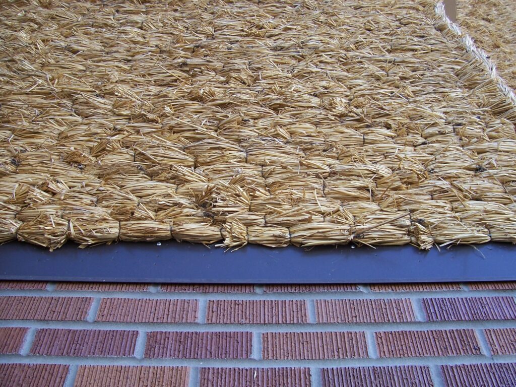 Close-up of corn husks thatched to form part of the building