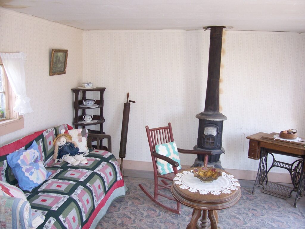 Cabin parlor was carpeted and wall papered