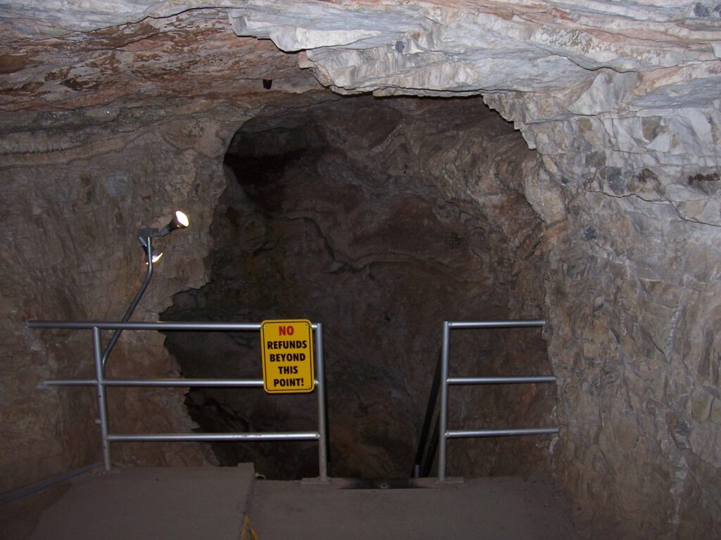 sign-at-top-of-ladder-into-cave-no-refunds-beyond-this-point