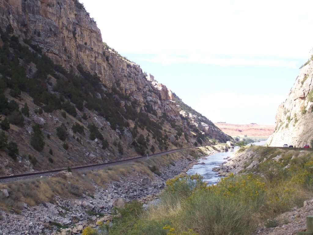photo-creek-alongside-road-and-hillside
