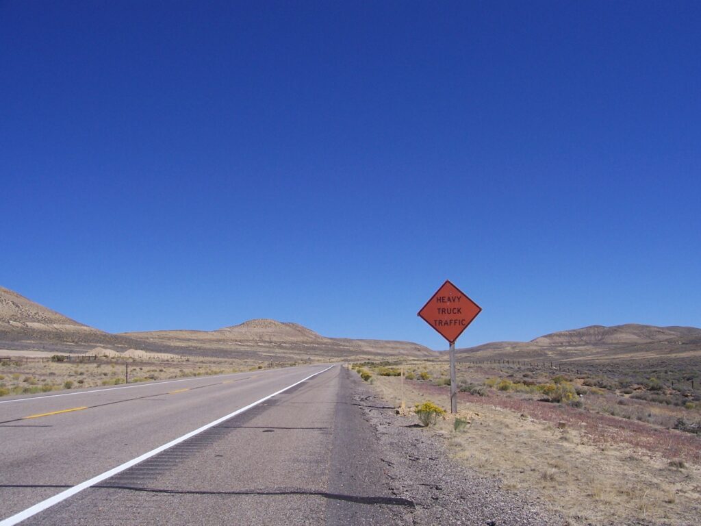 sign-heavy-truck-traffic-on-road-with-no-one-in-site-forever